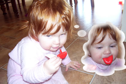 Photo of Emma with Mr Potato-head tongue, with thought balloons drawn in showing her with the plastic tongue sticking out of her mouth
